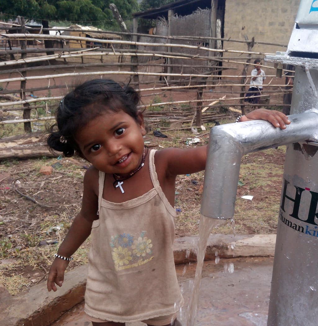 A joyful child holding hanapump