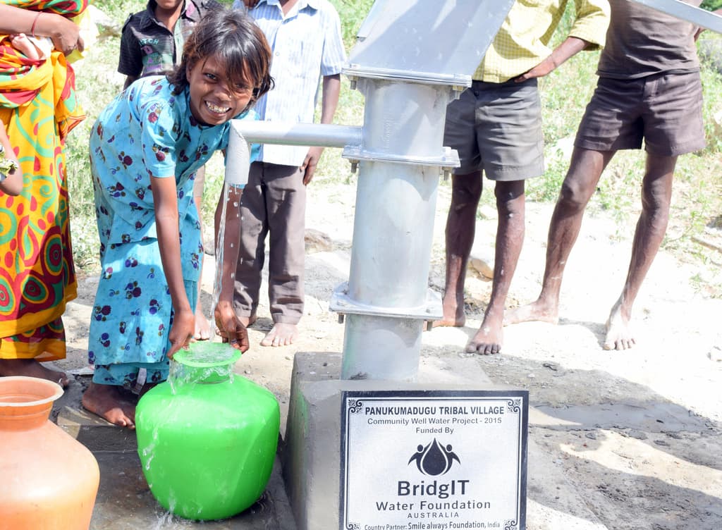 Clean water pouring from a hand pump
