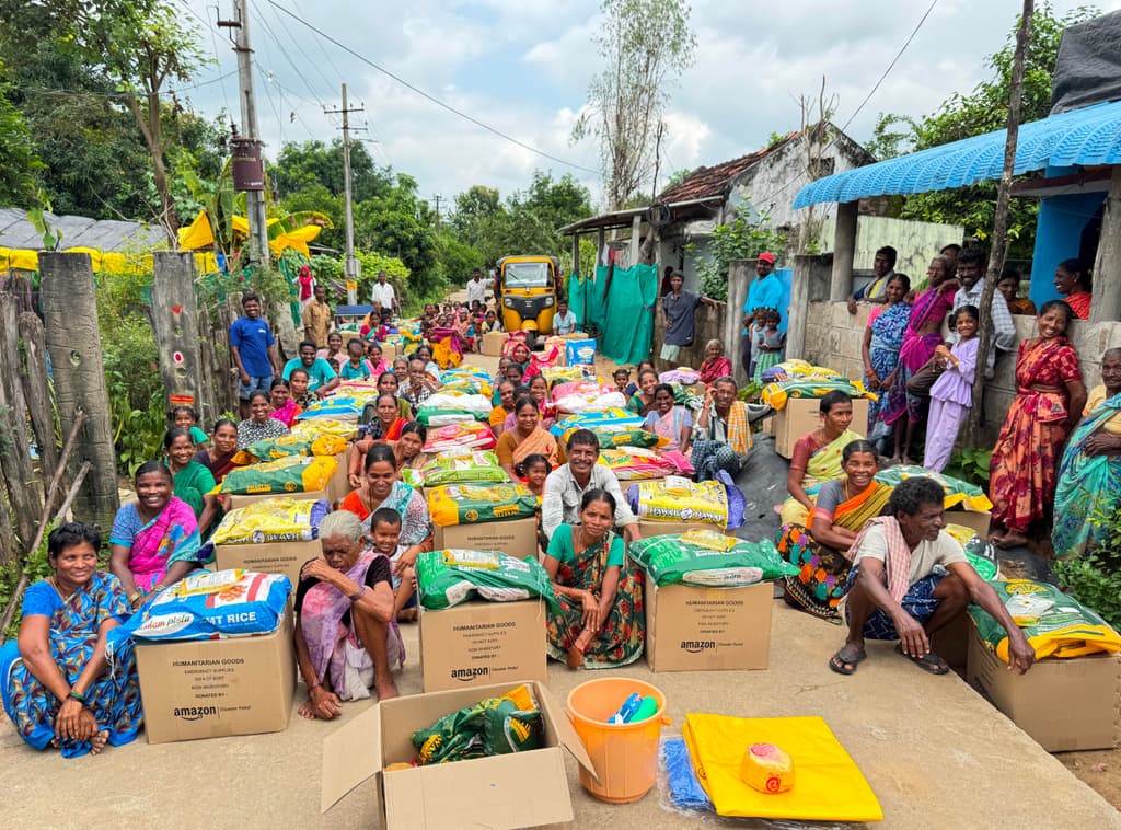 Hands holding a donation box during a relief effort
