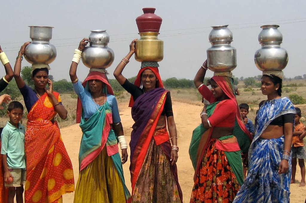 Clean water flowing from a community hand pump