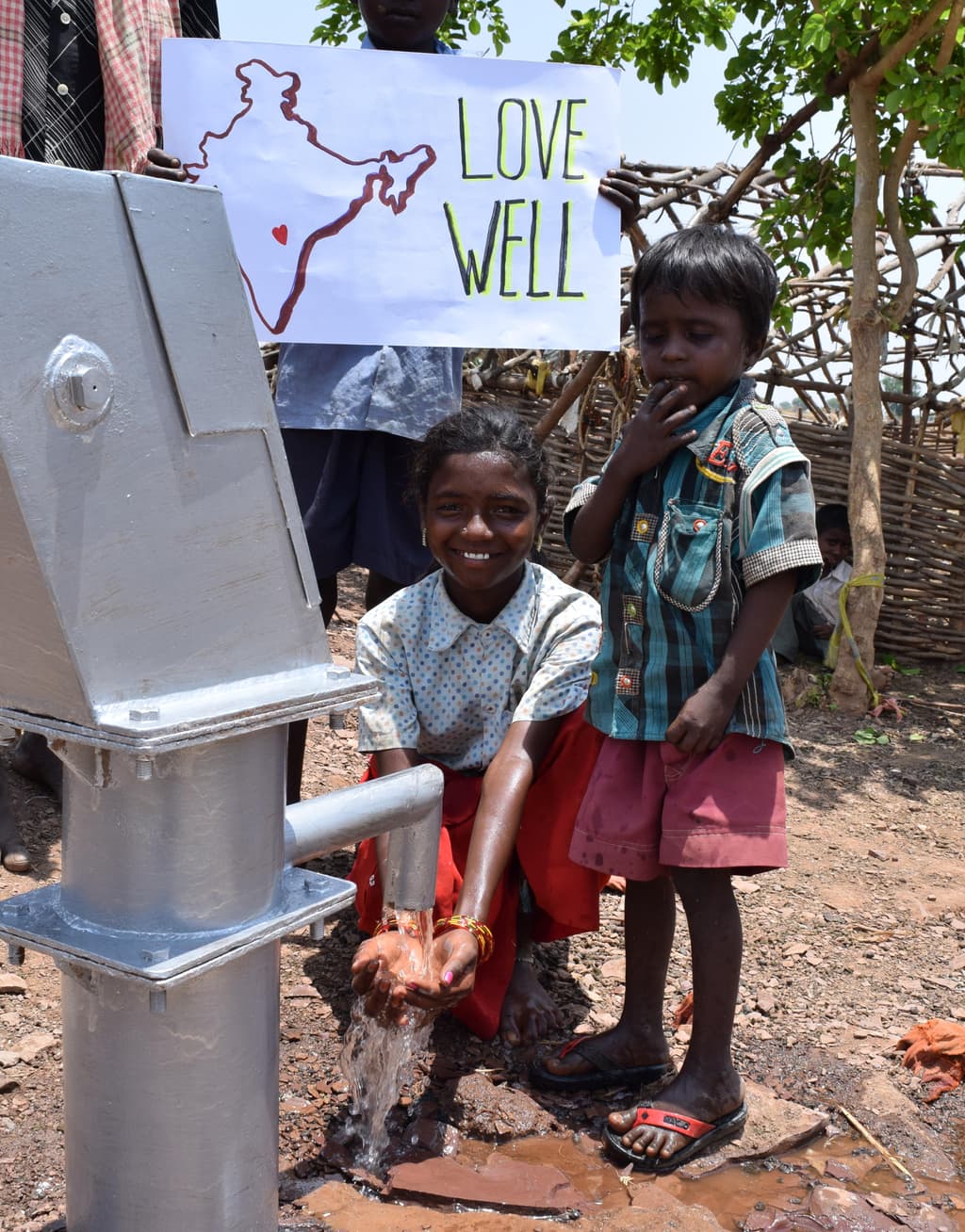 A village hand pump delivering clean water